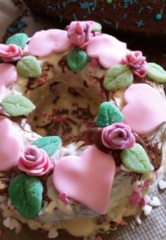 a cake decorated with pink and green frosting