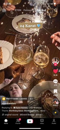 people sitting at a table with glasses of wine and food in front of their faces