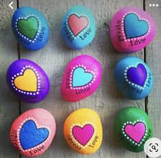 colorful painted rocks with hearts and words on them