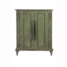 an old green cabinet with two doors