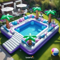 an inflatable pool surrounded by palm trees