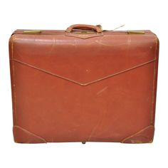 Vintage Genuine Top Grade Cowhide Brown Leather 24" Suitcase Luggage. Item features H.P.F. monogram, interior with compartments and sections, very nice vintage item, quality American craftsmanship, great style and form. Circa Mid 20th Century. Measurements: 7.5" H x 24" W x 18" D. Classic Brown Luggage For Formal Occasions, Elegant Brown Luggage For Formal Occasions, Brown Luggage With Luggage Sleeve For Formal Use, Classic Brown Cases For Business Trips, Vintage Rectangular Luggage For Business Trips, Classic Brown Luggage With Leather Lining, Classic Brown Formal Luggage, Vintage Luggage With Luggage Sleeve For Business Trips, Vintage Rectangular Cases For Business Trips