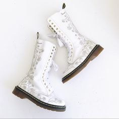 Vonda//1c57 14 Hole Tall White Boots With Trailing Roses Tooled/Etched Into The Leather. Dr Martens Authentic Docs. Would Be Amazing For A Bride, Bridal Shower, Wedding, Bacherlorette, Trendy Or Just Cus You Want Some Gorgeous Boots. ** Several Scuffs Overall, There Is A Chunk Missing Out Of The Edge Of One Boot And A Chunk Missing Out Of The Top Near The Vamp. There Is Some Glue Discoloration On The Interior. ***No Original Doc Marten Laces. The Laces Are Ribbon Laces That Were Added By Me. Sin Bridal Hiking Boots, Bridal Doc Martens, White Laced Boots For Spring, White Fitted Boots With Flat Heel, Fitted White Boots With Flat Heel, White Lace-up Boots For Wedding, White Round Toe Boots For Wedding, White Round Toe Wedding Boots, White Leather Boots For Wedding