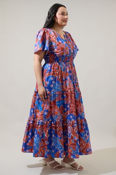 Just imagine how adorable you will look in our best selling Palmer Poplin Maxi Dress that is now in this amazing and darling blue and red floral print. It features billowed short sleeves that frame a split neckline where it meets a smocked waistline. Side pockets sit at the seam of a ruffle tiered midi skirt. Wear the dress with red heels for a chic look!- Tiered- Smocked waist- Pockets- Ruffle details- Color: Burg MultiSize + Fit - Model is 5'10" and wearing size 2X- Measurements taken from siz Dress With Red Heels, Tiered Midi Skirt, Red Floral Print, Just Imagine, Red Heels, Tiered Maxi Dress, Cotton Style, Red Floral, Blue Floral