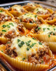 a casserole dish with meat and cheese stuffed into muffins in it