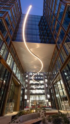 an illuminated spiral in the middle of a building