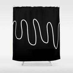 a black shower curtain with white lines on it