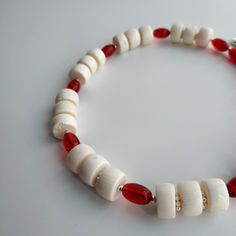 < One strand white coral and glass beaded necklace> The coral is natural, from the bottom of the Pacific Ocean. The clasp is made from metal. > Necklace length - 38 cm (14,9 in) > Necklace weight - 41 grams White Glass Beaded Necklaces With Colorful Beads, White Glass Beaded Necklace For Beach, White Glass Beaded Necklaces For The Beach, White Glass Necklaces For Beach, Handmade Red Shell Necklace For Gift, Handmade Red Shell Necklace Gift, White Glass Necklaces For The Beach, White Polished Glass Bead Jewelry, White Glass Jewelry With Polished Beads