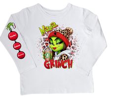 This Grinch Nana/Tata shirt brings the holiday spirit to your wardrobe! Its festive design and cozy fabric will have you feeling merry and bright all season long! Crafted from comfortable and durable material, this shirt will make a perfect addition to your holiday wardrobe. Let the Grinch bring cheer to your style this year! Winter Holiday Long Sleeve T-shirt, Green Tops For Fall Holiday, Green Festive Top For Winter, Green Festive Tops For Winter, Festive Green Tops For Winter, Winter Holiday Long Sleeve Tops, Green Long Sleeve Holiday Top, Festive Long Sleeve Holiday T-shirt, Holiday Long Sleeve Top With Graphic Print