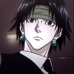 an anime character with black hair and green earring's looking at the camera