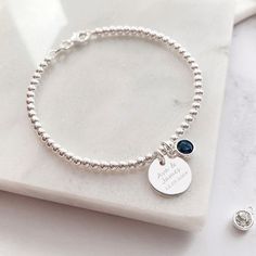 Combining our Engraved Jewellery & our Birthstone Charm to make a perfectly personalised bracelet you'll love! This beautiful silver bracelet combines our silver disc charm, perfect for engraving a name or special date, with our sparkling Swarovski birthstone charm. Unsure as to what your stone is? Use our handy graphic to find out & whilst your there find out your besties, mums & little ones too! The sterling silver disc charm measures 12mm across the front of the heart and sits centrally on a Adjustable Silver Name Bracelet With Birthstone, Sterling Silver Round Bracelet With Birthstone, Silver Minimalist Bracelet With Birthstone, Silver Minimalist Bracelets With Birthstone, Minimalist Silver Bracelets With Birthstone, Personalized Silver Beaded Bracelets For Anniversary, Personalized Sterling Silver Beaded Bracelets As Gift, Personalized Sterling Silver Round Bracelet For Anniversary, Personalized Sterling Silver Bracelet For Anniversary