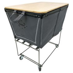 a large black cooler sitting on top of a wooden table