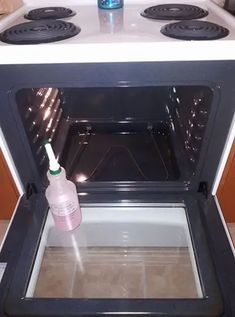 an empty bottle is sitting in the oven