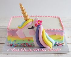 there is a cake decorated with a unicorn on it