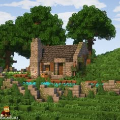 a small house in the middle of a lush green field with trees and bushes around it