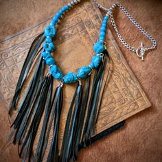 Nwt From My Craft Boutique Handcrafted Boho Western Turquoise Color Stone Chunk Beaded Necklace W Black Pu Leather Fringe Toggle Clasp 22" Long 7" Additional In Length For Fringe Unique One Of A Kind Design Turquoise Jewelry With Black Beads For Festival, Black Southwestern Necklaces For Festivals, Black Southwestern Necklace For Festival, Southwestern Style Black Necklace For Festivals, Southwestern Style Black Necklace For Festival, Handmade Adjustable Black Turquoise Necklace, Bohemian Adjustable Black Turquoise Necklace, Faceted Glass Bead Necklace, Craft Boutique