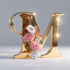 the letter m is decorated with flowers and jewels in gold letters that spell out love