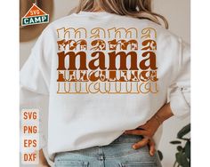 a woman wearing a white shirt with the words mama and daughter printed on it in orange