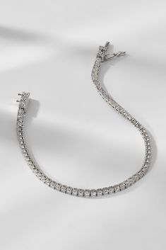 A style staple, this elegant tennis bracelet adds a touch of elegance to any outfit. Classic and timeless, this essential accessory seamlessly stacks with other bracelets or adds a pop of sparkle and shine all on its own. Shop all Perfect Tennis styles here. Silver Tennis Bracelet For Everyday Luxury, Silver Tennis Bracelet With Prong Setting For Everyday Luxury, Luxury Silver Tennis Bracelet With Jubilee Style, Silver Diamond Tennis Bracelet For Everyday Luxury, Fine Jewelry Silver Tennis Bracelet For Everyday Luxury, Luxury Silver Tennis Bracelet With Sparkling Stones, Timeless Silver Tennis Bracelet With Diamond Accents, Silver Diamond Cut Tennis Bracelet For Everyday Luxury, Silver Cubic Zirconia Flexible Tennis Bracelet