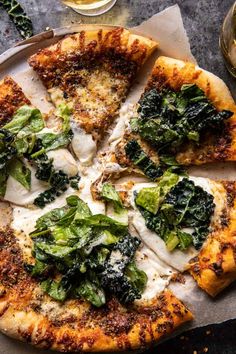 a pizza sitting on top of a pan covered in cheese and spinach