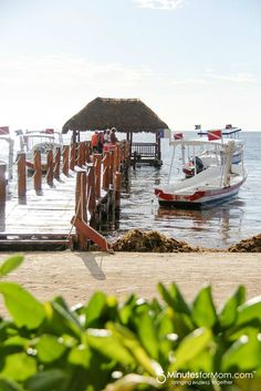 the boat is docked at the pier on the water