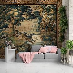 a living room filled with furniture and a tapestry on the wall