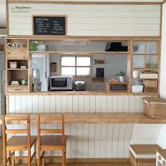 the small kitchen is clean and ready to be used as a coffee shop or cafe