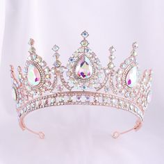 High-Quality Materials: princess crown Made from durable metal alloy with a polished finish, this Princess Tiara is built to last and maintain its elegance for years to come. The premium crystals provide a touch of sophistication and glamour. Stunning Design: Our luxurious royal crown features an exquisite, handcrafted design, adorned with sparkling crystals that catch the light beautifully, crystal crown making you feel like true royalty on your special day. Crown Making, Quinceanera Crown, Wedding Tiara Hairstyles, Bridal Crown Tiara, Prom Gift, Crystal Bridal Tiaras, Crystal Tiara, Tiara Hairstyles, Rhinestone Tiara