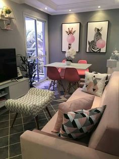 a living room filled with furniture and a flat screen tv