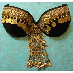 an elaborately decorated bra hanging on a wall