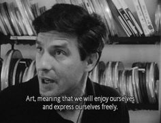 a man is talking to someone in front of some shelves with cds on them and the words art means that we will enjoy ourselves