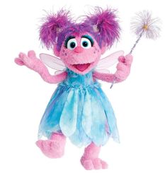 a pink and blue stuffed animal holding a sparkle wand