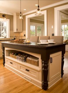 a large kitchen island with drawers underneath it