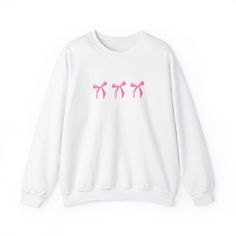 The softest, cutest bow sweatshirt. Perfect for cold days, colder nights with a trendy pink bow design Casual Long Sleeve Sweater With Bow, Casual Long Sleeve Bow Sweater, Cute Pink Sweater With Letter Print, Cute Pink Letter Print Sweater, Pink Bow Top For Fall, Cute Pink Crew Neck Sweatshirt, Casual Crew Neck Top With Pink Bow, Casual Long Sleeve Tops With Bow, Crew Neck Cotton Top With Pink Bow