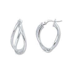 Two teardrops of 14K white gold loosely twist to form each of these contemporary hoop earrings. The earrings are secured with hinged backs. White Gold Teardrop Hoop Earrings With Polished Finish, Modern Twist Hoop Earrings For Formal Occasions, Hypoallergenic Teardrop Hoop Earrings In White Gold, Silver Small Hoop Teardrop Earrings, Elegant Silver Small Teardrop Earrings, Modern Formal Hoop Earrings With Polished Finish, Formal Hoop Earrings With Modern Twist And Polished Finish, Modern Twist Hoop Earrings For Anniversary, Small Hoop Earrings With Modern Twist For Formal Occasions