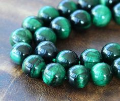 the beads are green and black in color