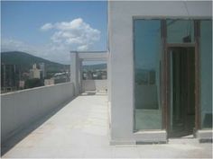 an open window on the roof of a building