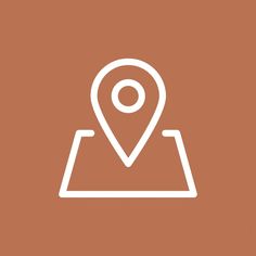 a map pin icon on a brown background