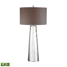 a silver lamp with a brown shade on it's base and a light grey fabric shade