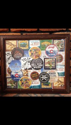 a wooden frame with various beer labels on it