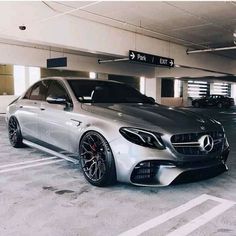 a silver car parked in a parking garage