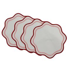 four red and white plates sitting on top of each other