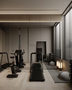 a gym with treadmills, exercise machines and other equipment in front of large windows