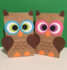 two brown paper bags with owls on them