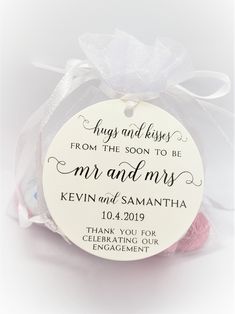 a round wedding ornament with the words, hugs and kisses from the soon to be mr and mrs