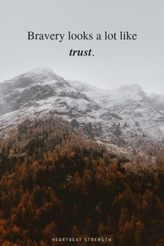 a mountain covered in snow and trees with the words, brave looks a lot like trust