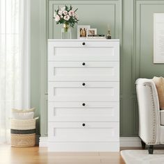 a white chest of drawers in a living room