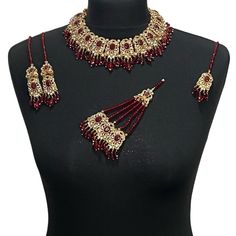 Pakistani jewellery set. Set includes - Earrings  Necklace  Tikka Jhumar Red Beaded Kundan Necklace For Wedding, Red Temple Jewelry Choker For Wedding, Red Temple Jewelry Wedding Choker, Red Choker Jewelry For Wedding, Red Jewelry Sets For Celebration, Red Choker For Wedding And Festivals, Red Wedding Choker Jewelry, Red Kundan Choker Necklace For Wedding, Red Bollywood Jewelry With Stone Work