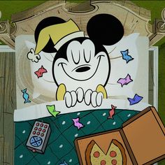 an image of mickey mouse sleeping in bed