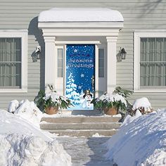 a red door is open in front of a house